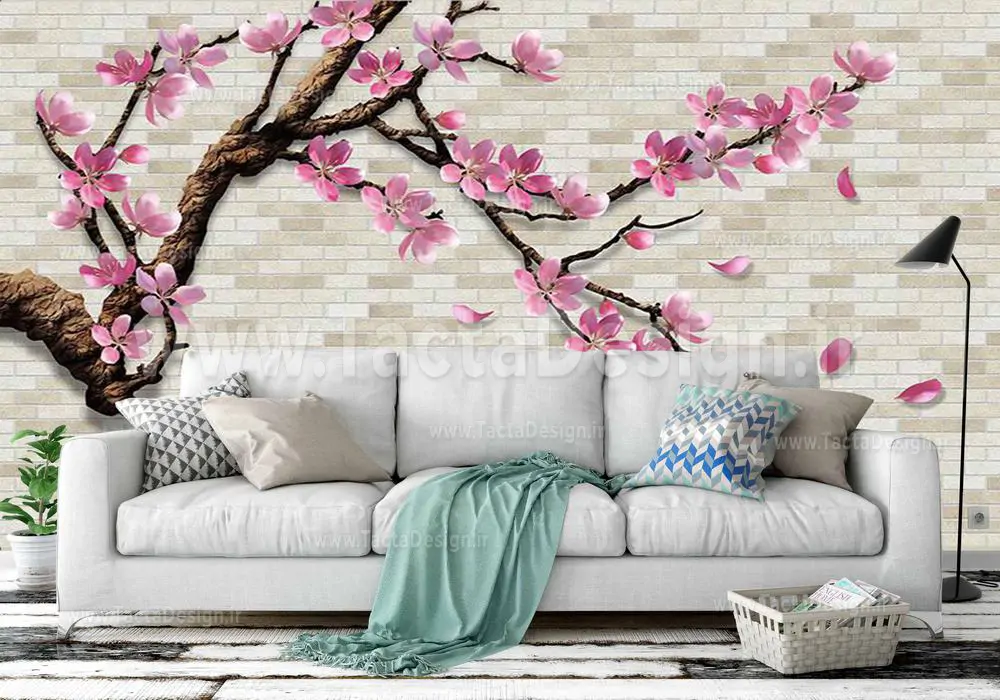 شاخه قهوه ای زیبا با شکوفه های زیبای صورتی همراه با بکگراند دیوار آجری